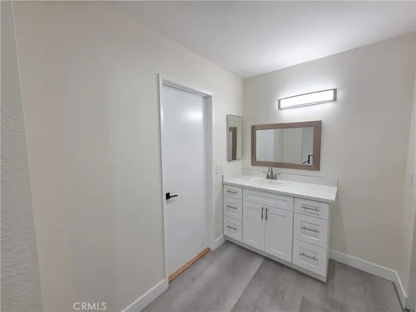 a bathroom with a double vanity sink and mirror