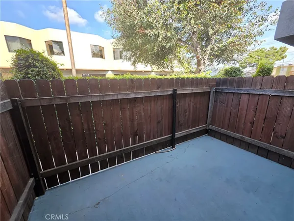 a view of outdoor space with wooden fence