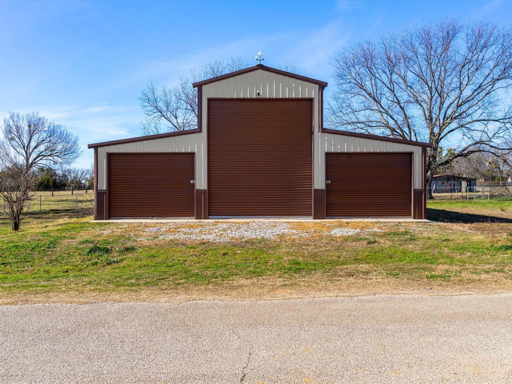 Tbd South Ewing Street Boyd, TX 76023 - Photo 1 of 24 a front view of building with yard
