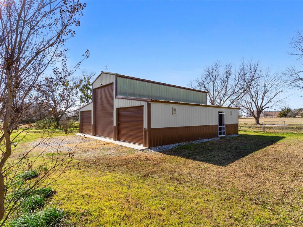 Tbd South Ewing Street Boyd, TX 76023 - Photo 5 of 24 a front view of a house with a yard