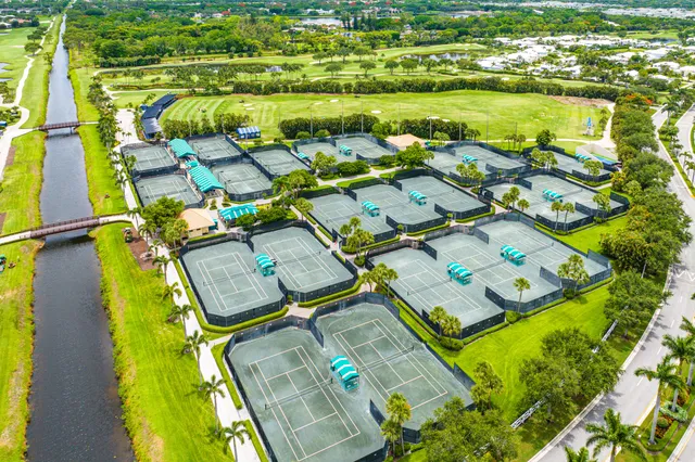 a view of swimming pool with a lounge chairs