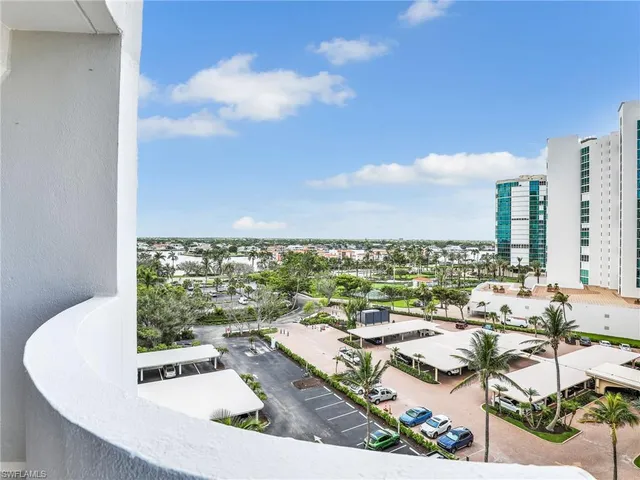 a view of a balcony with table and chairs