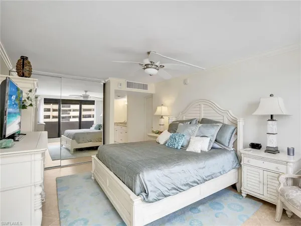 a bedroom with a bed and a couch