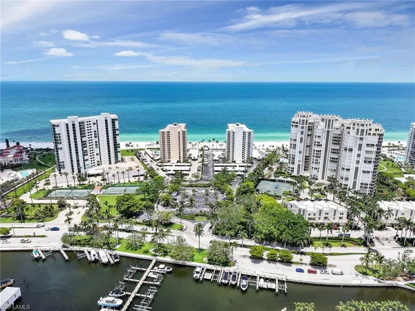 a view of swimming pool with outdoor seating and plants