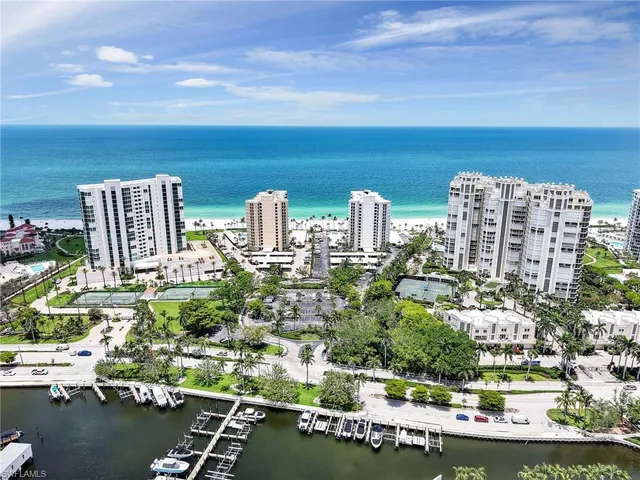 a view of swimming pool with outdoor seating and plants