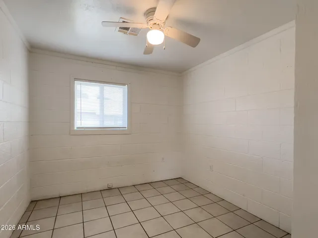 a bathroom with a sink a toilet a mirror and bathtub