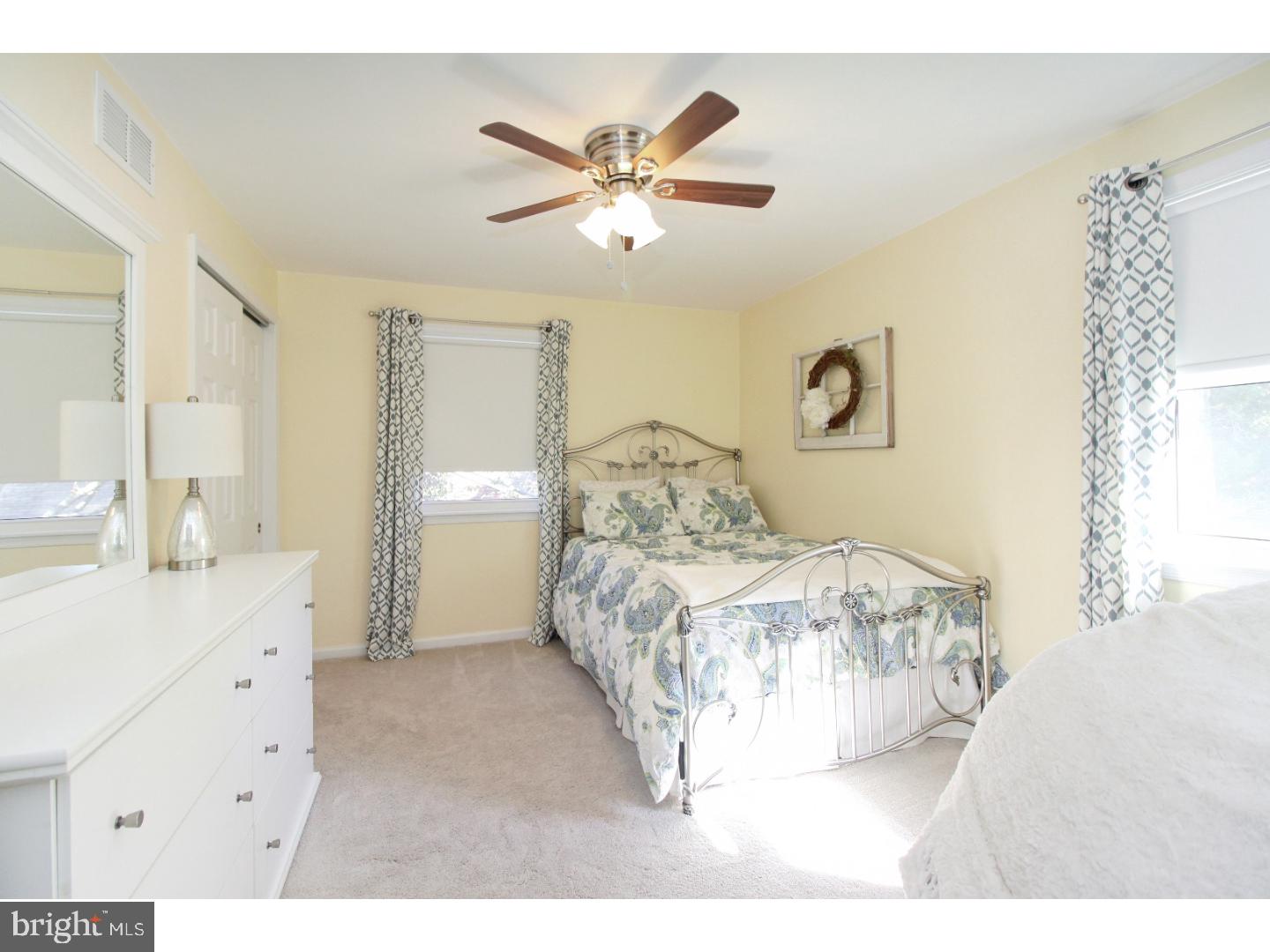 735 Rhoads Drive Springfield, PA 19064 - Photo 13 of 25 a bedroom with a large bed and a chandelier