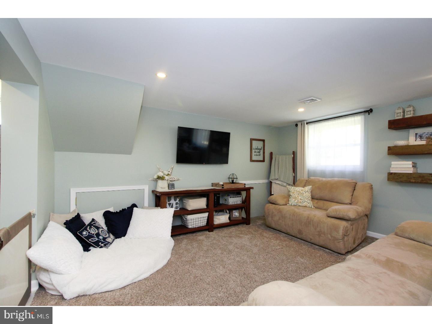 735 Rhoads Drive Springfield, PA 19064 - Photo 17 of 25 a living room with furniture and a flat screen tv