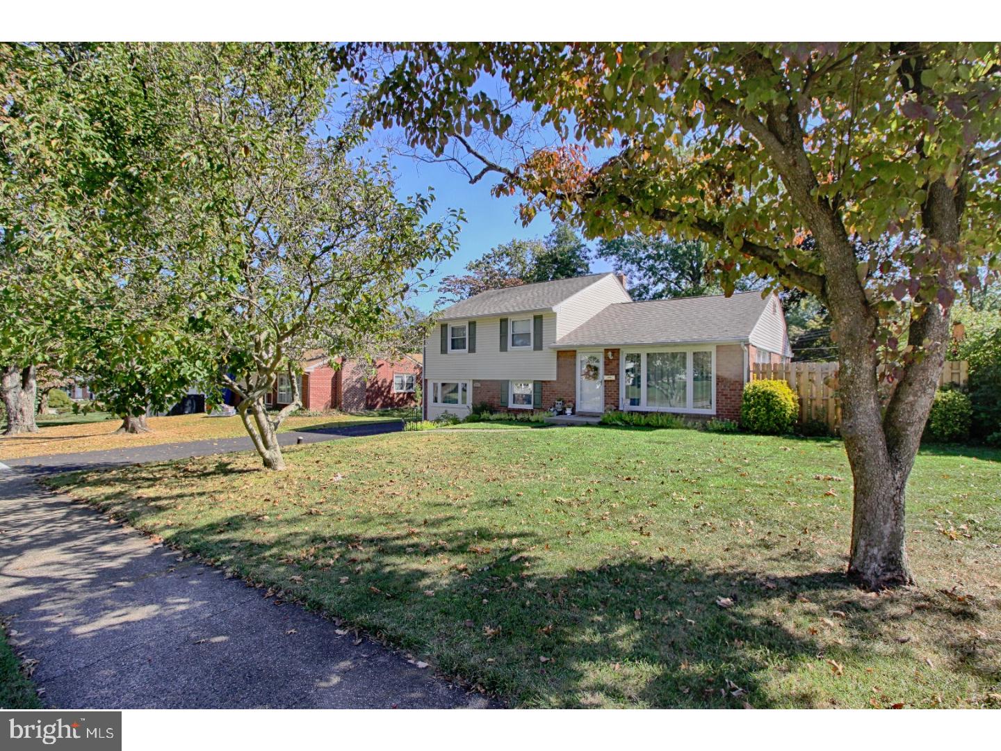735 Rhoads Drive Springfield, PA 19064 - Photo 3 of 25 a house view with a garden space