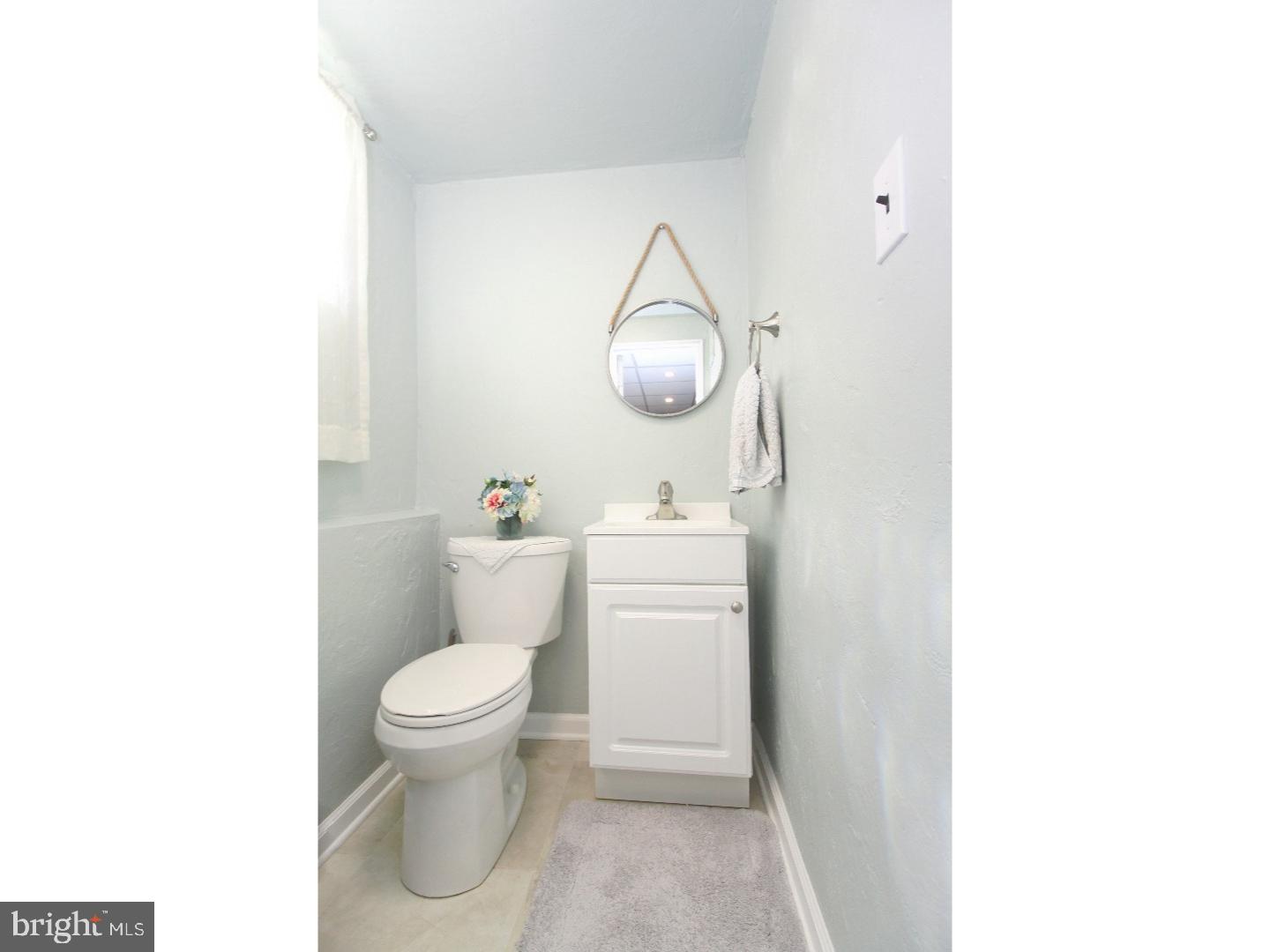 735 Rhoads Drive Springfield, PA 19064 - Photo 21 of 25 a bathroom with a toilet and a mirror