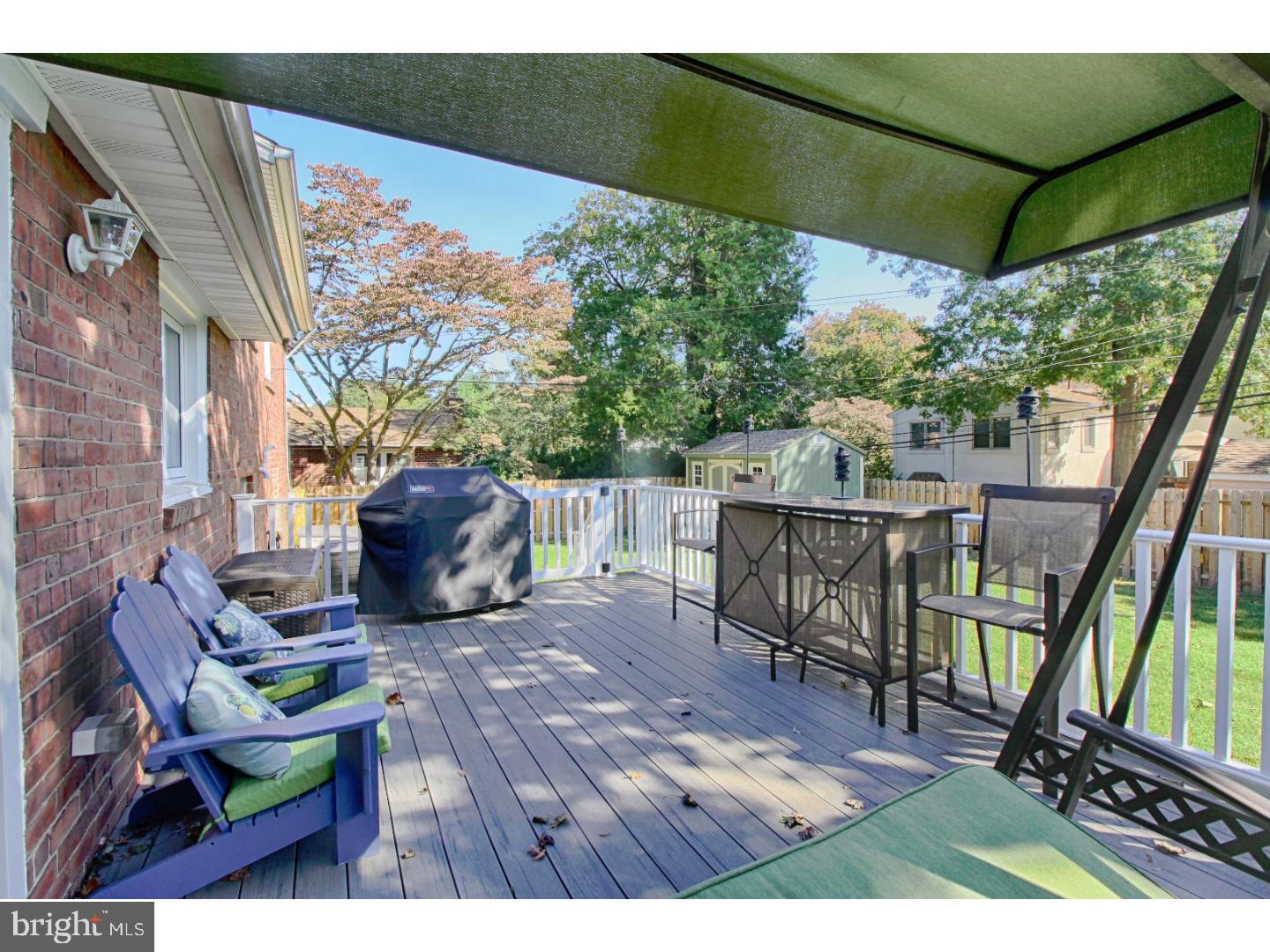 735 Rhoads Drive Springfield, PA 19064 - Photo 23 of 25 a view of a patio with table and chairs potted plants with wooden floor