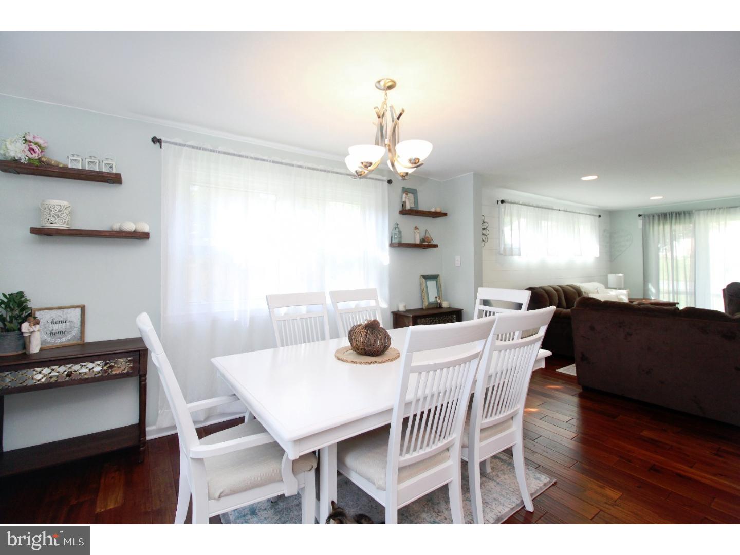 735 Rhoads Drive Springfield, PA 19064 - Photo 7 of 25 a view of a dining room with furniture and wooden floor