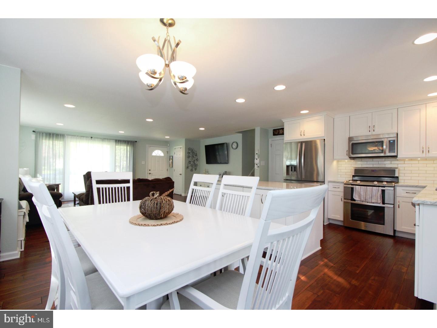 735 Rhoads Drive Springfield, PA 19064 - Photo 8 of 25 a view of a dining room with furniture and wooden floor