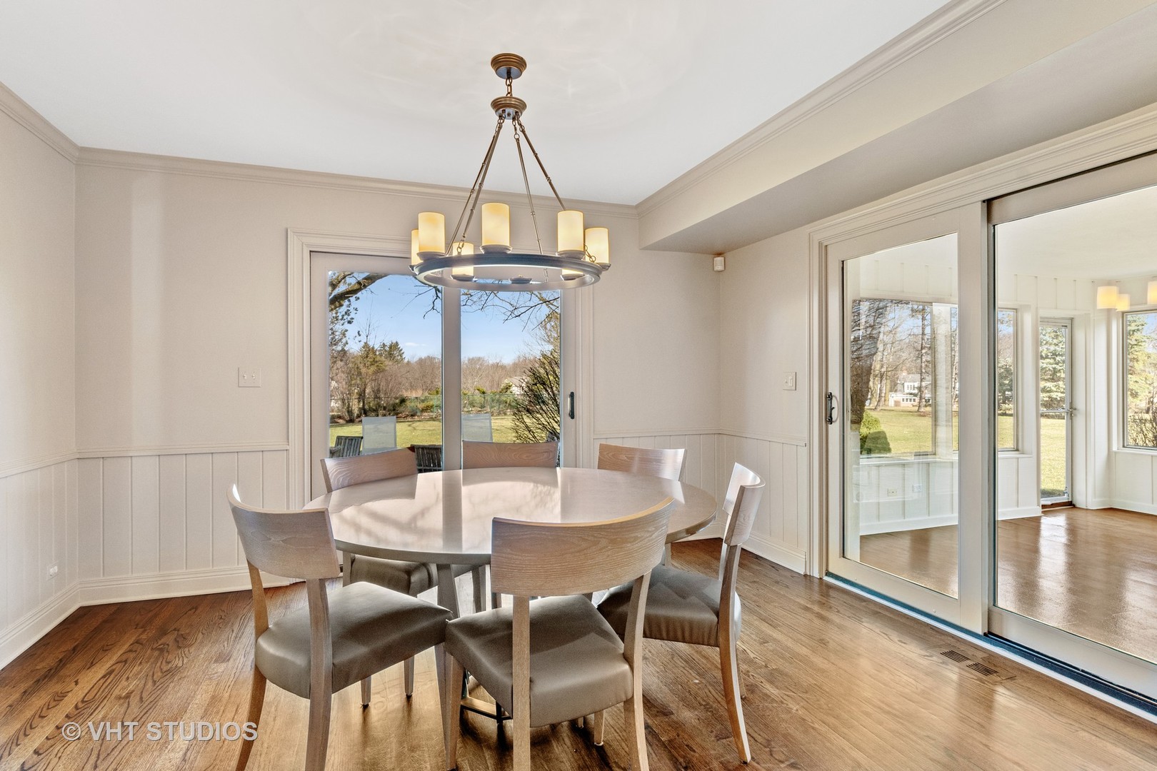 1850 South Ridge Road Lake Forest, IL 60045 - Photo 14 of 34 a view of a dining room with furniture wooden floor and chandelier