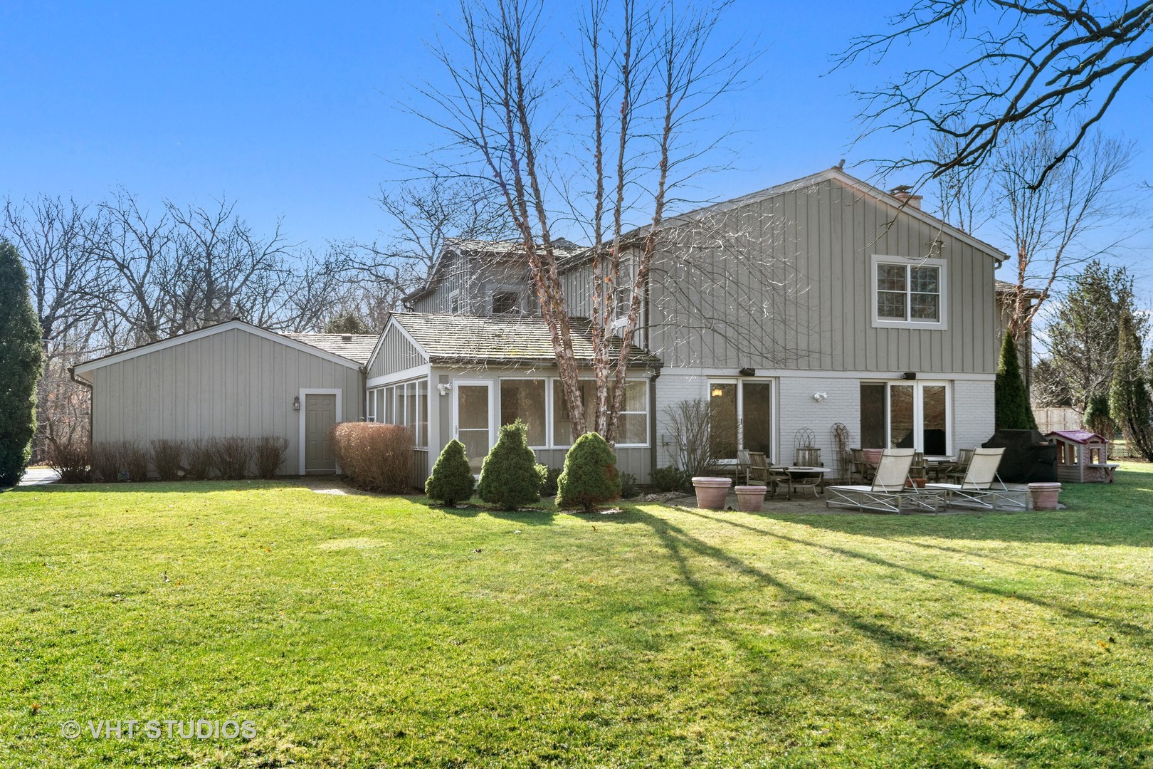 1850 South Ridge Road Lake Forest, IL 60045 - Photo 2 of 34 a view of a house with backyard and sitting area