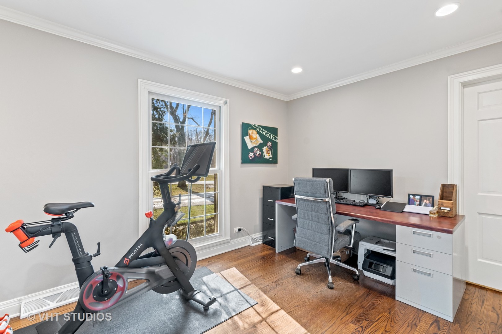 1850 South Ridge Road Lake Forest, IL 60045 - Photo 8 of 34 a view of a workspace with furniture and a gym cycle