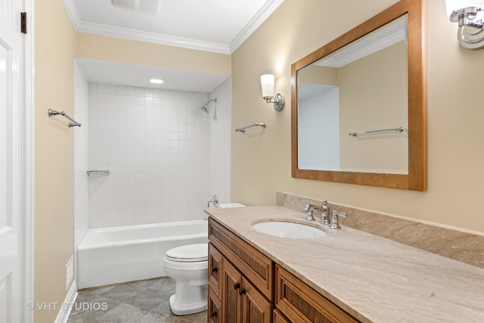 1850 South Ridge Road Lake Forest, IL 60045 - Photo 9 of 34 a bathroom with a granite countertop sink toilet and shower