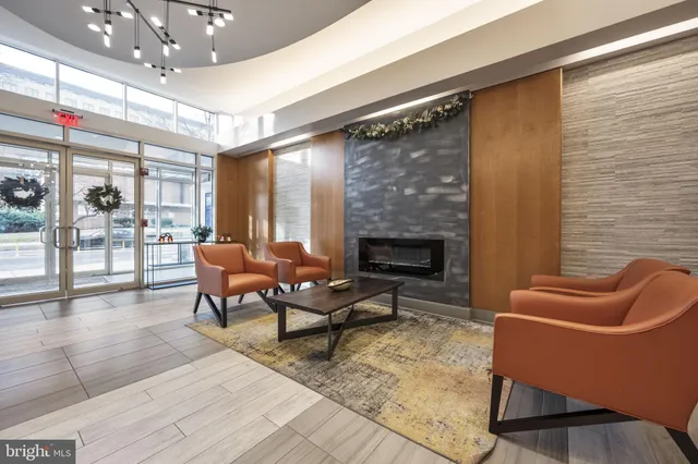 a outdoor living space with patio furniture and a fireplace