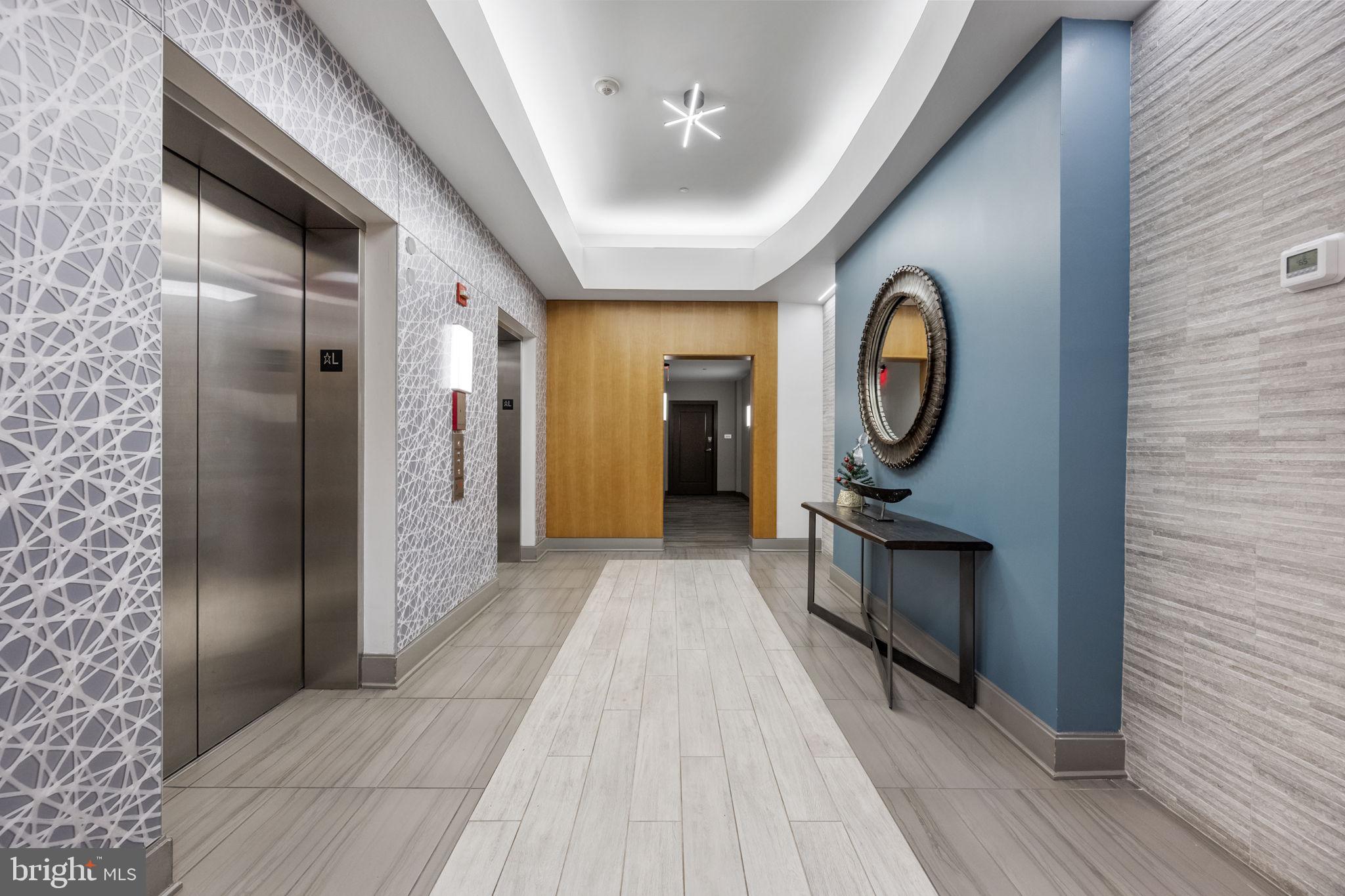 355 I Street Southwest, Unit 226 Washington, DC 20024 - Photo 17 of 23 a view of hallway with washer and dryer