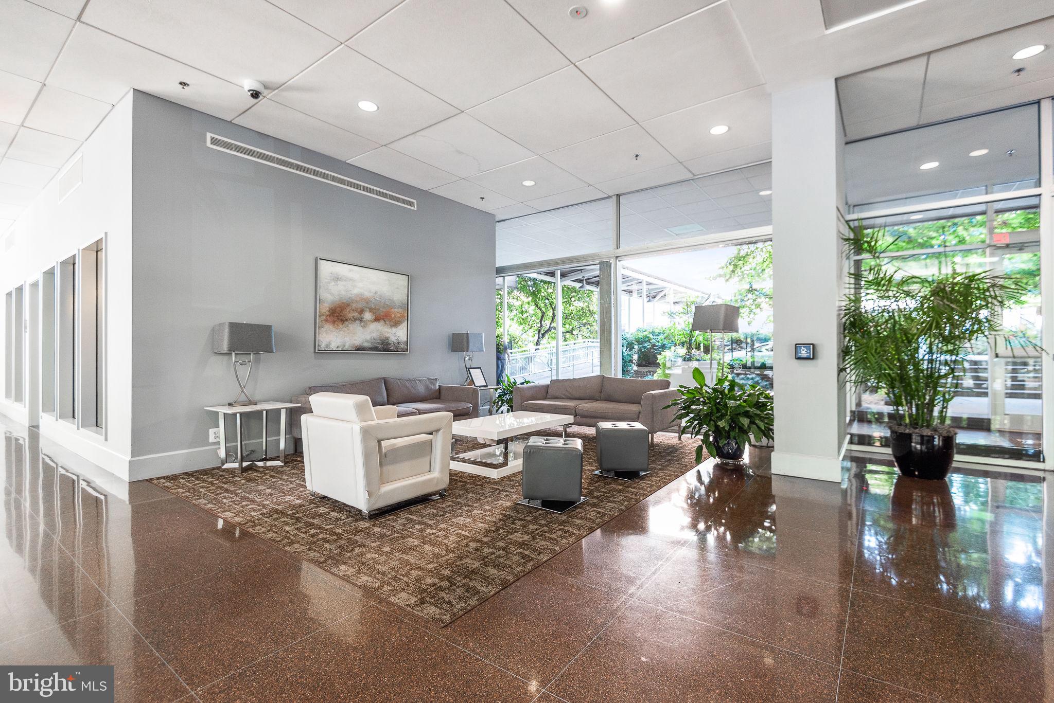 355 I Street Southwest, Unit 226 Washington, DC 20024 - Photo 18 of 23 a living room with furniture and a large window