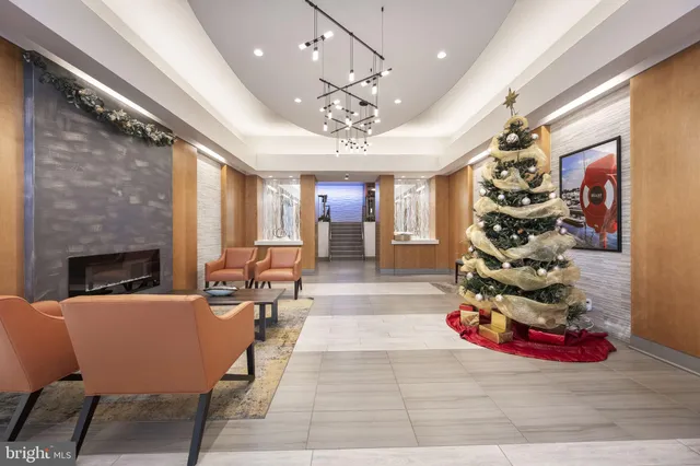 a view of a livingroom with furniture a chandelier