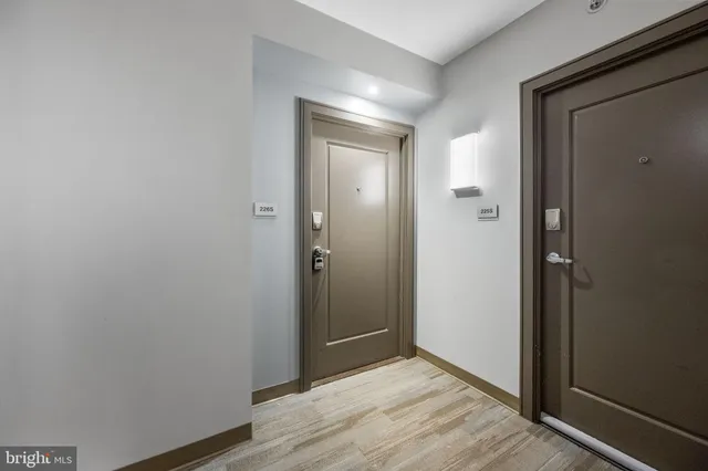 a view of hallway with wooden floor