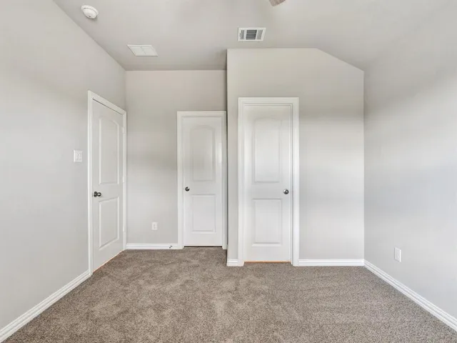 a view of a kitchen with stainless steel appliances granite countertop a stove a refrigerator and a sink