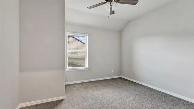 a room with a sink and a mirror