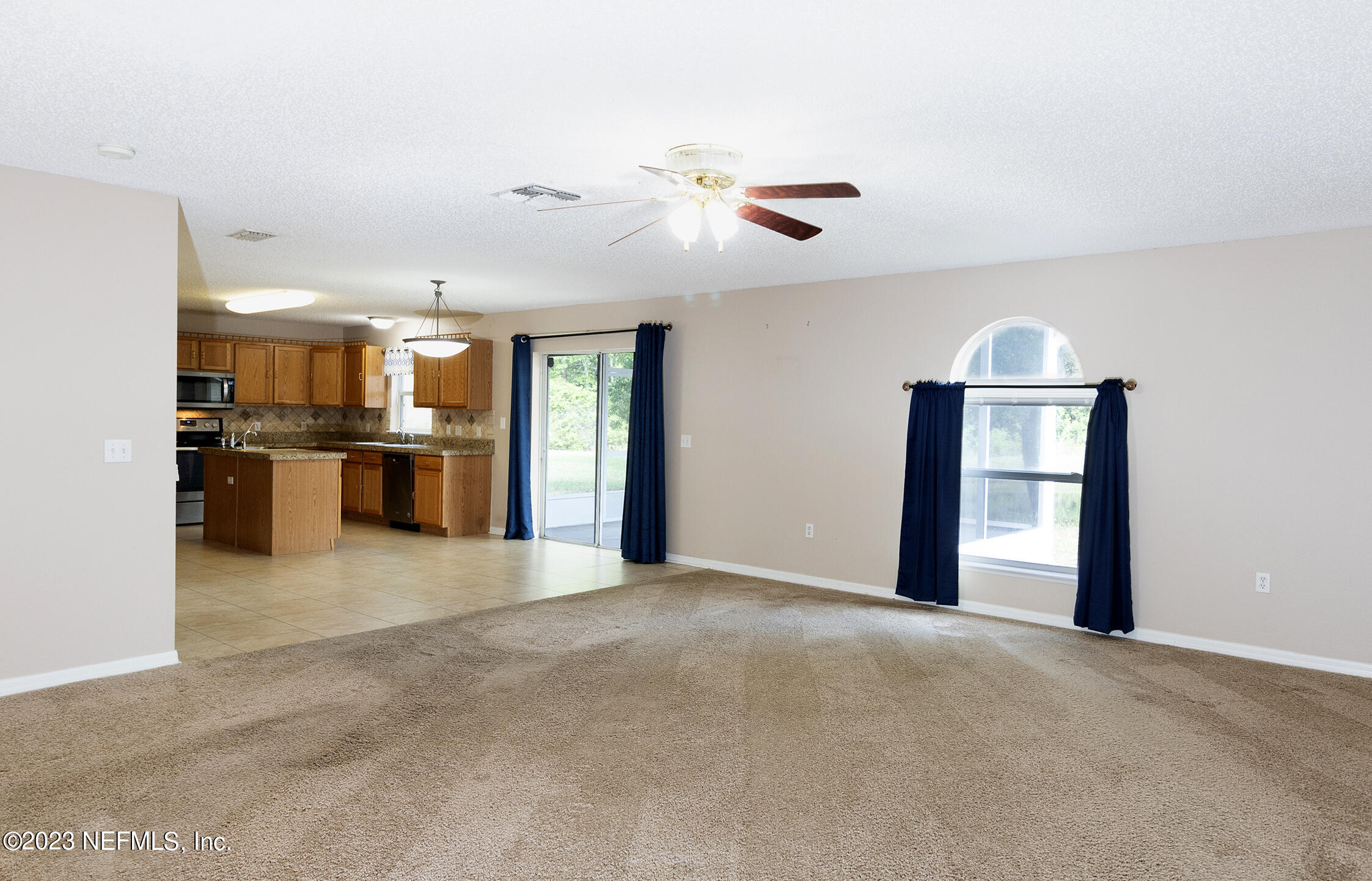 1490 Seawolf Trail Jacksonville, FL 32221 - Photo 15 of 36 a view of an empty room with a kitchen