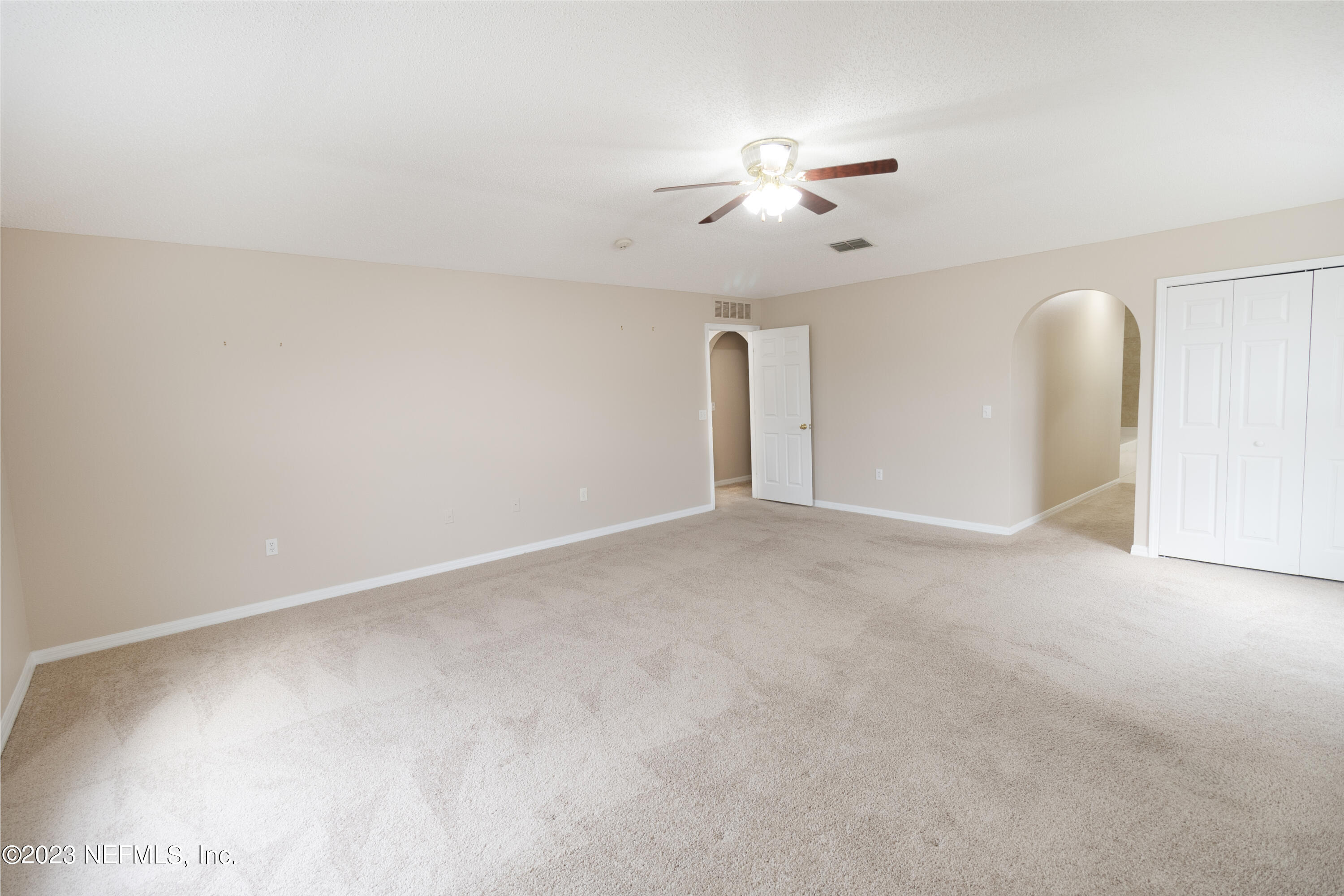 1490 Seawolf Trail Jacksonville, FL 32221 - Photo 21 of 36 a view of an empty room with a chandelier fan