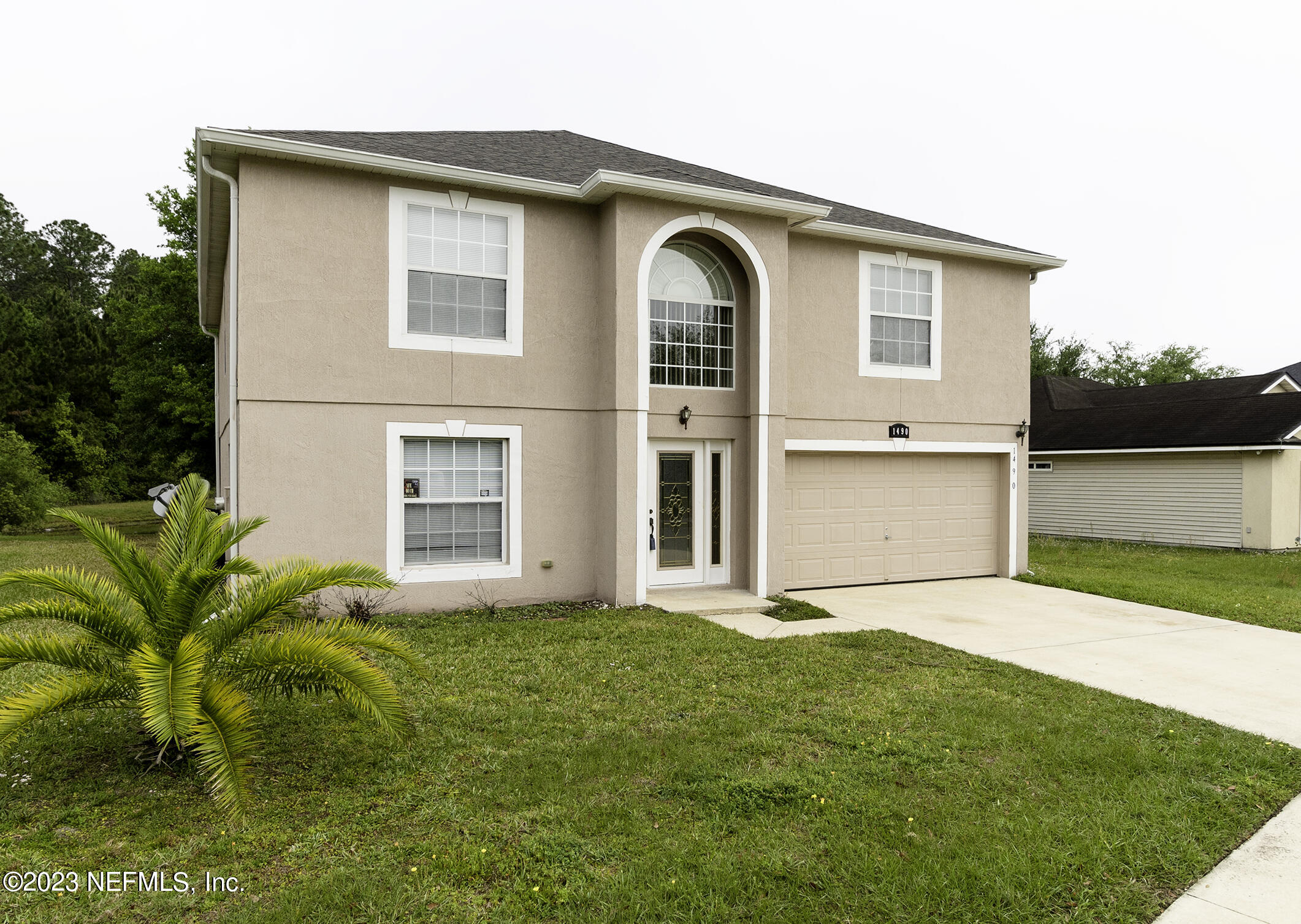 1490 Seawolf Trail Jacksonville, FL 32221 - Photo 3 of 36 a front view of a house with a yard