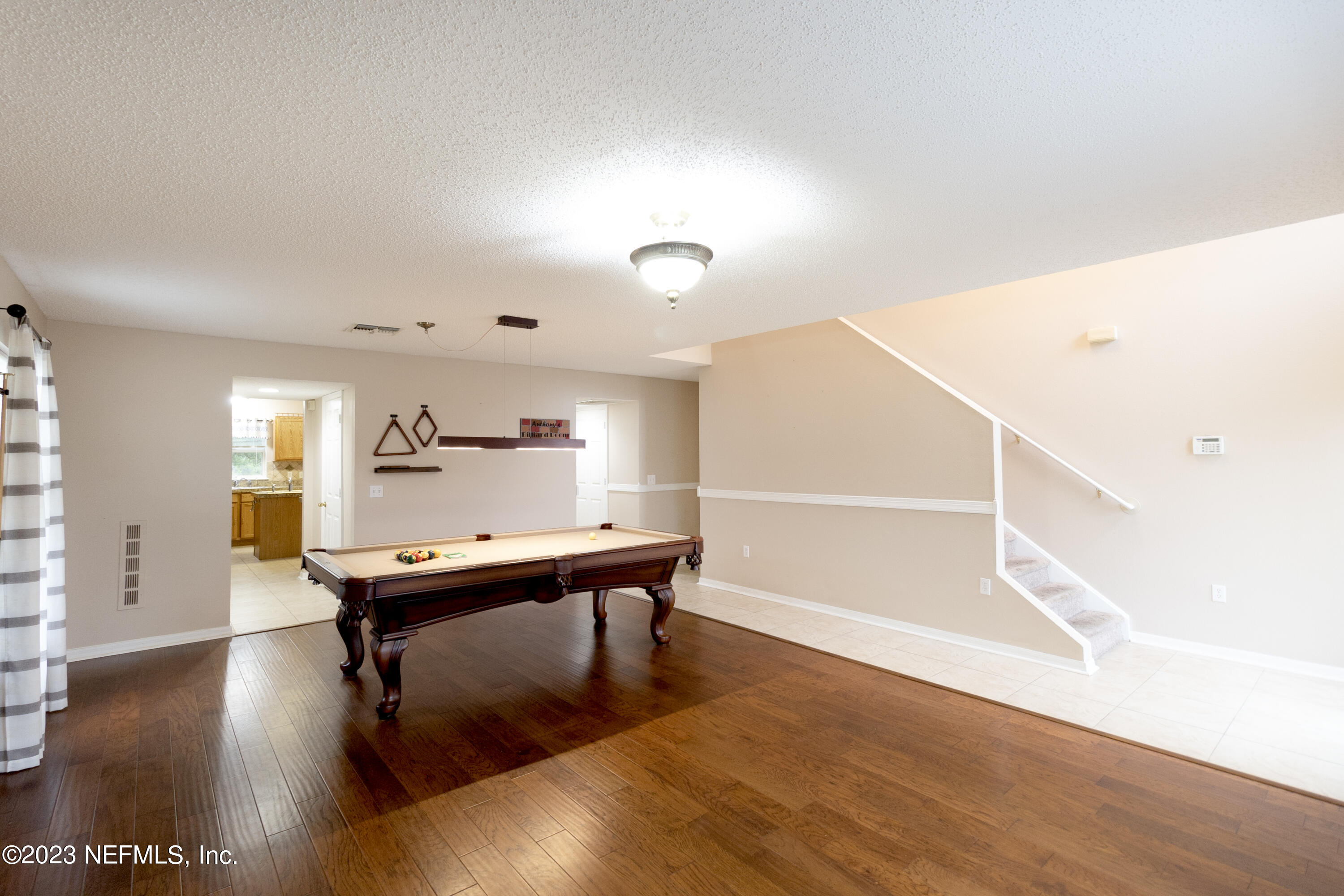 1490 Seawolf Trail Jacksonville, FL 32221 - Photo 4 of 36 a view of a room with wooden floor table and chairs
