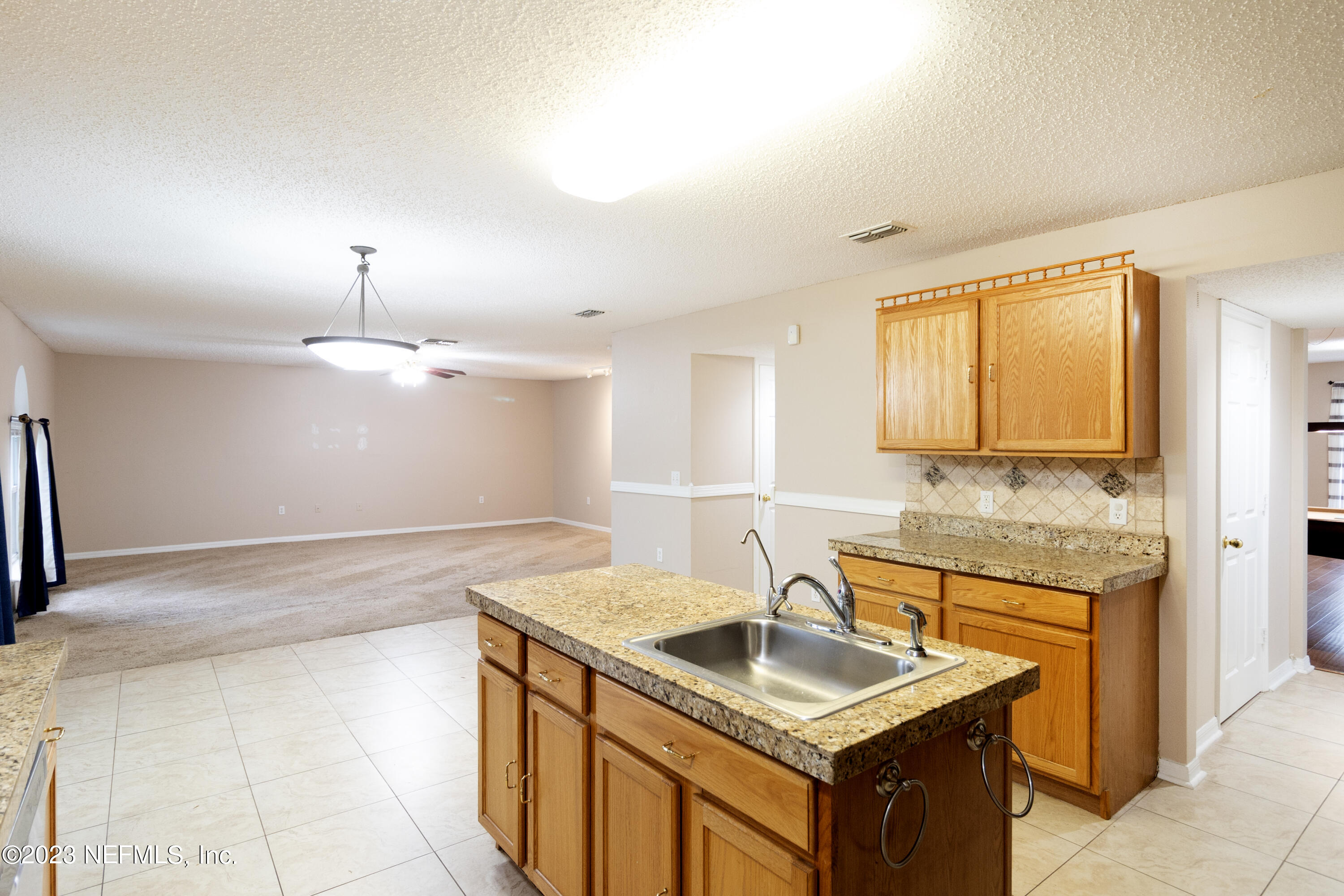 1490 Seawolf Trail Jacksonville, FL 32221 - Photo 10 of 36 a kitchen with a sink stove and cabinets