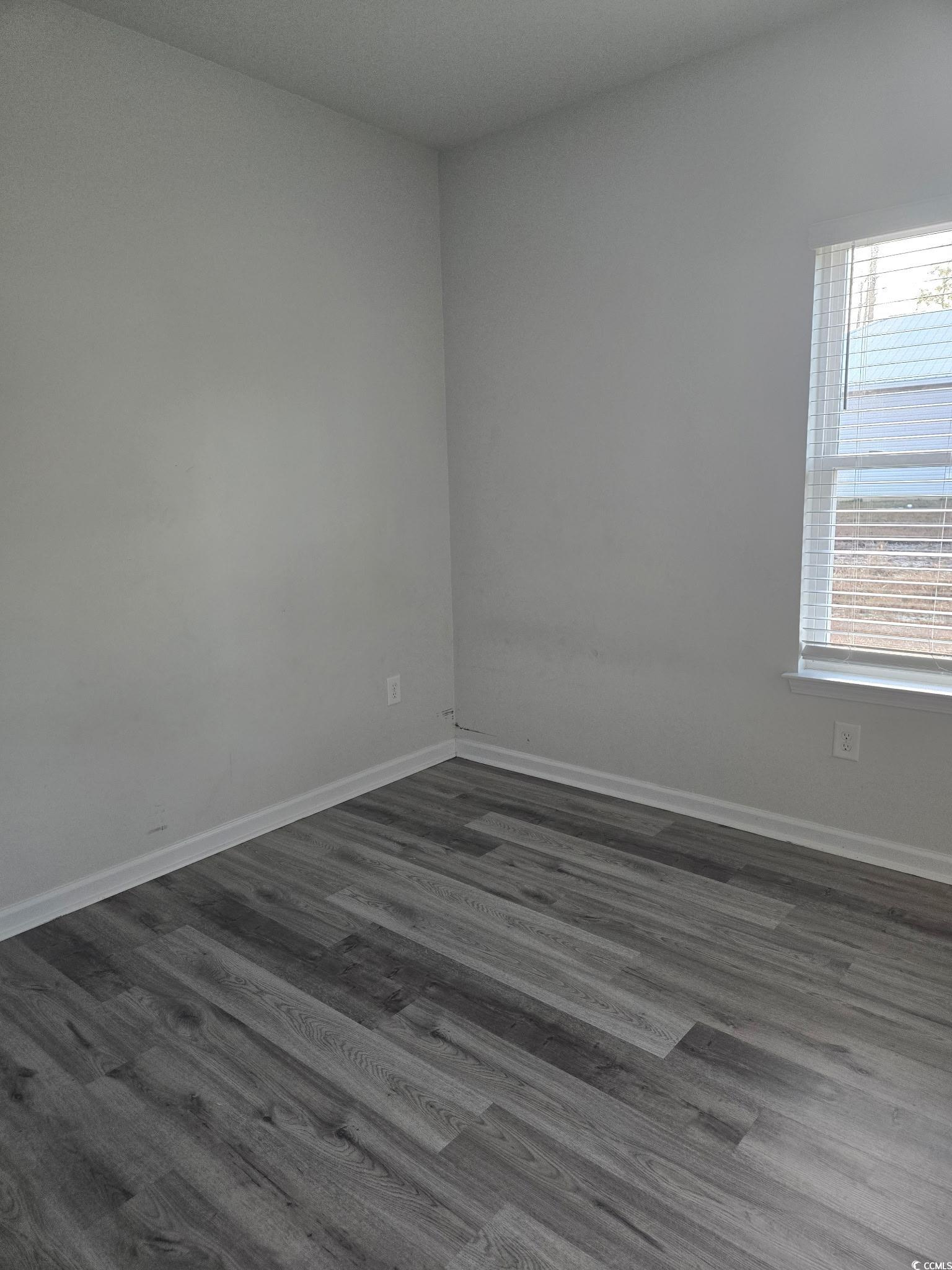 2027 6th Avenue Conway, SC 29526 - Photo 2 of 7 Unfurnished room featuring dark wood finished floors and baseboards