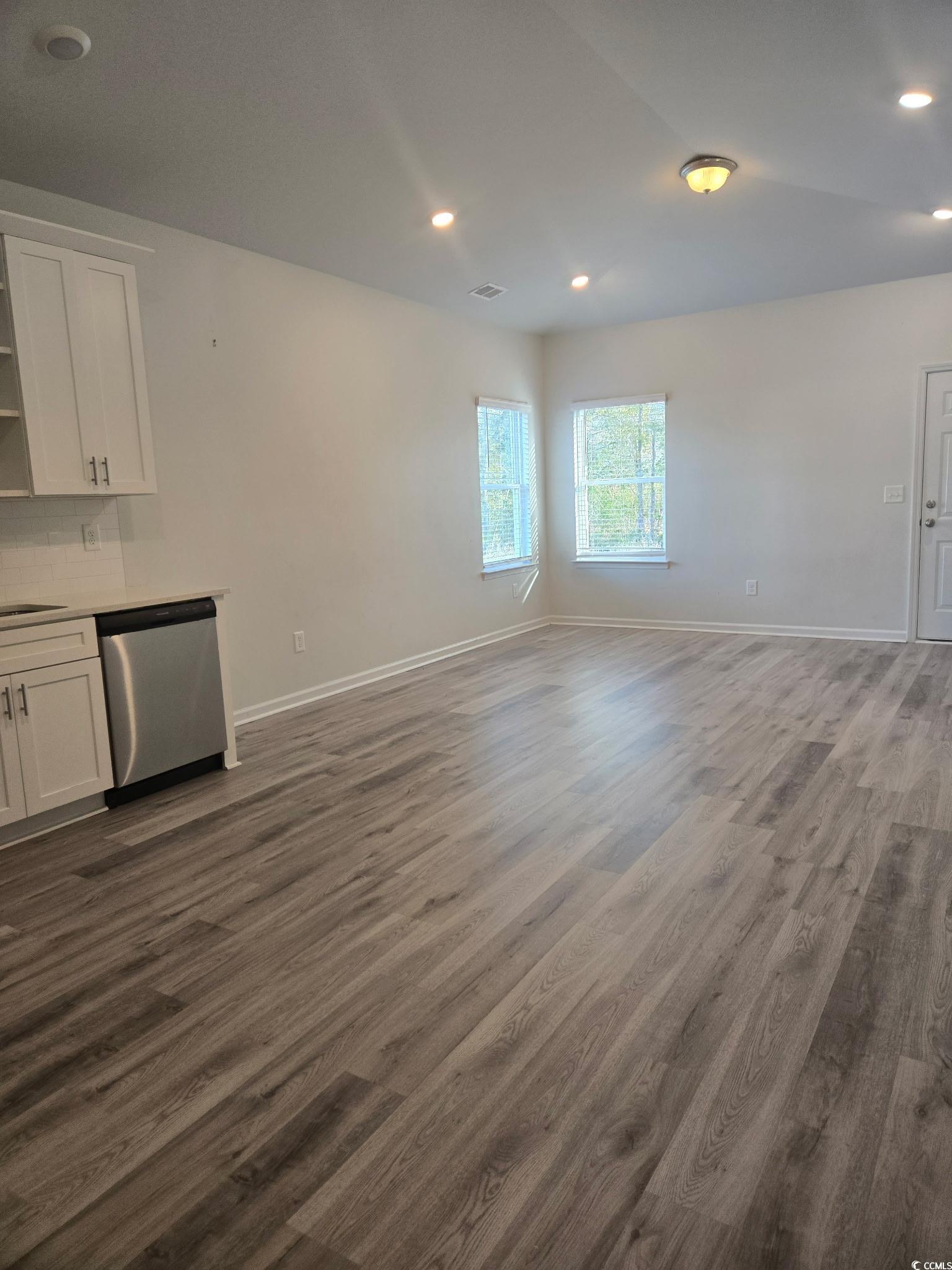 2027 6th Avenue Conway, SC 29526 - Photo 5 of 7 Unfurnished living room featuring recessed lighting and dark wood-type flooring