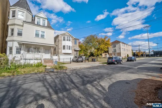 a view of street with parked cars