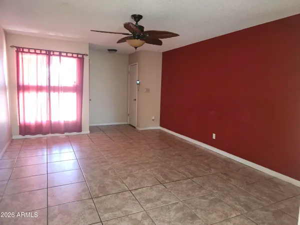 a view of an empty room with a window