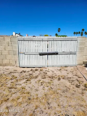 a view of a swimming pool with a yard