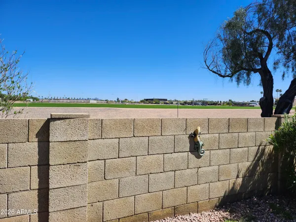 a view of a room with wooden floor and staircase