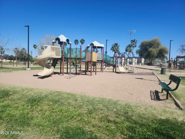 a swimming pool with outdoor seating