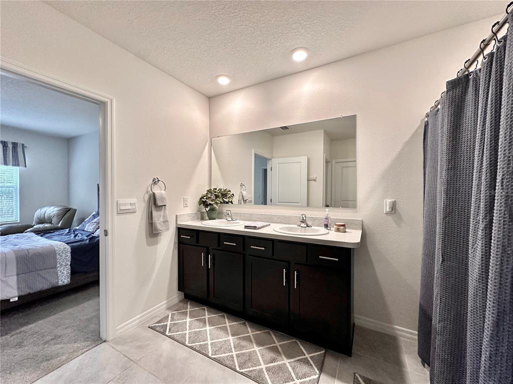 19 Hickory Course Radiel Ocala, FL 34472 - Photo 12 of 22 a bathroom with a double vanity sink and mirror