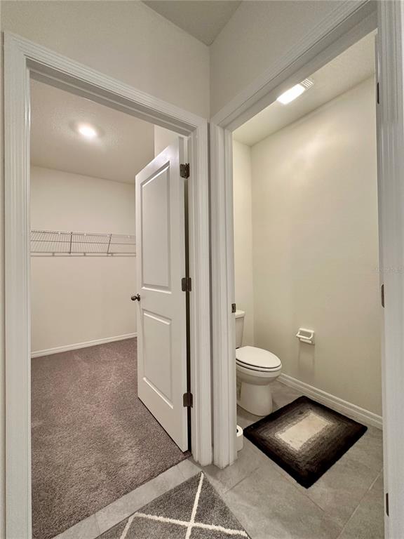19 Hickory Course Radiel Ocala, FL 34472 - Photo 13 of 22 a bathroom with a toilet sink and a mirror