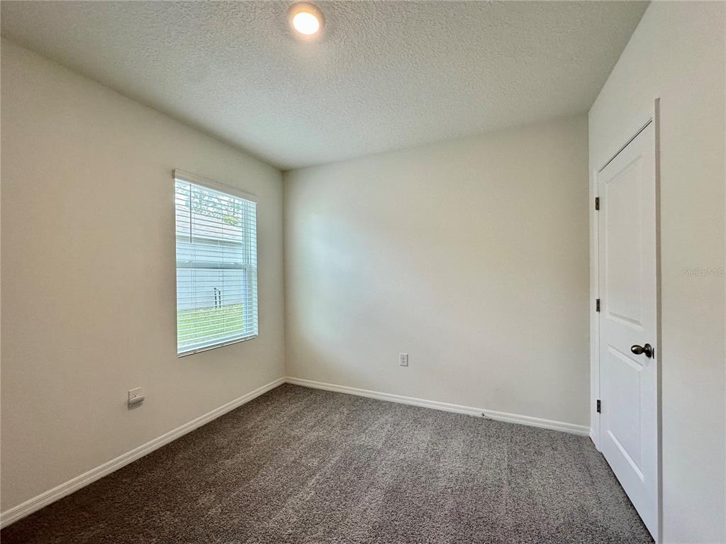 19 Hickory Course Radiel Ocala, FL 34472 - Photo 18 of 22 an empty room with a window