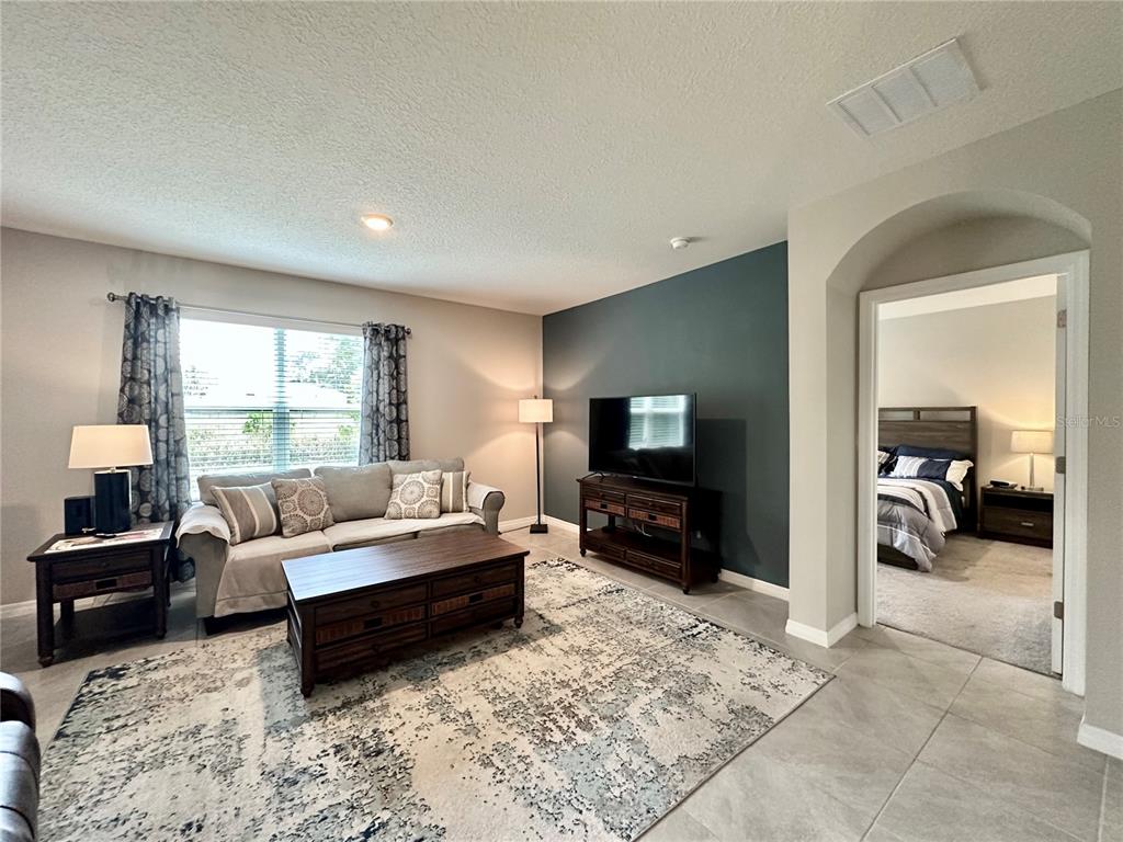 19 Hickory Course Radiel Ocala, FL 34472 - Photo 2 of 22 a living room with furniture and a flat screen tv