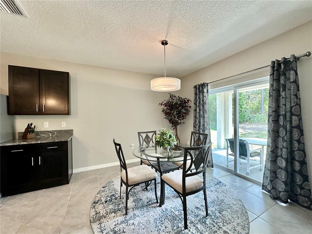 19 Hickory Course Radiel Ocala, FL 34472 - Photo 4 of 22 a dining room with furniture and window