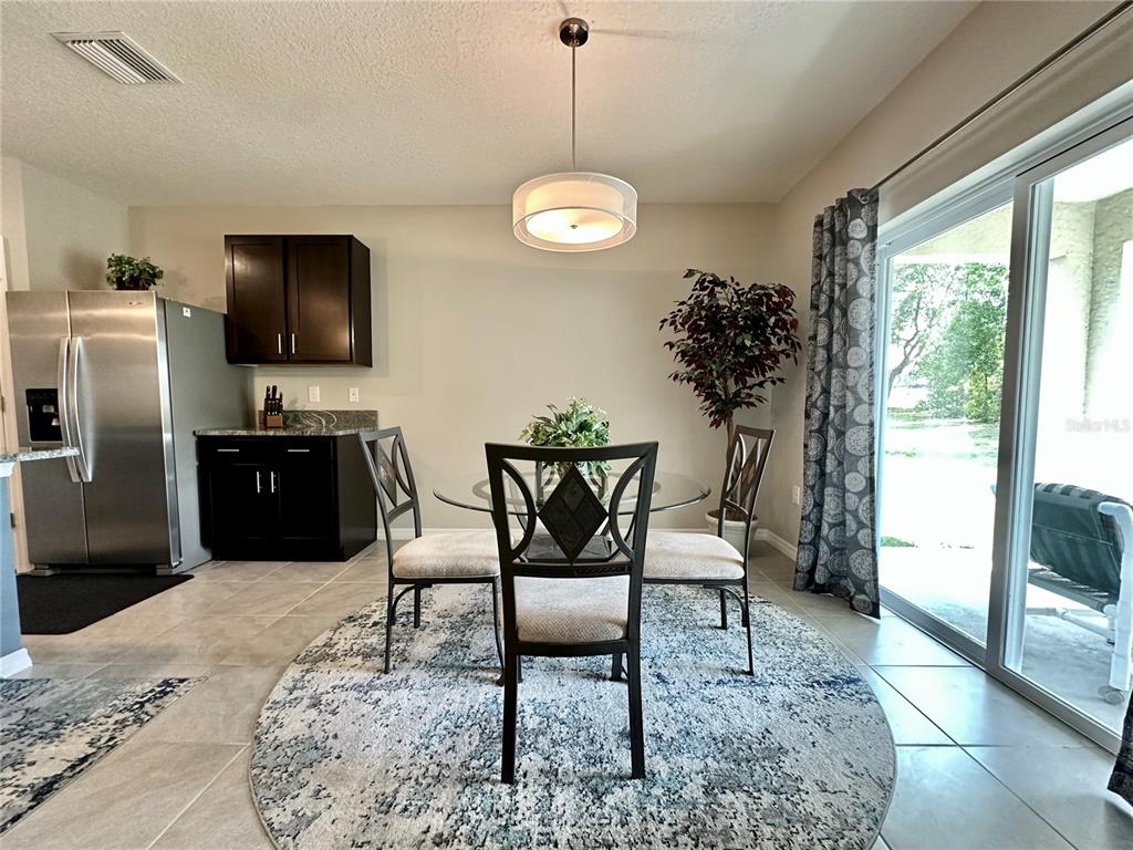 19 Hickory Course Radiel Ocala, FL 34472 - Photo 5 of 22 a view of a dining room with furniture window and outside view
