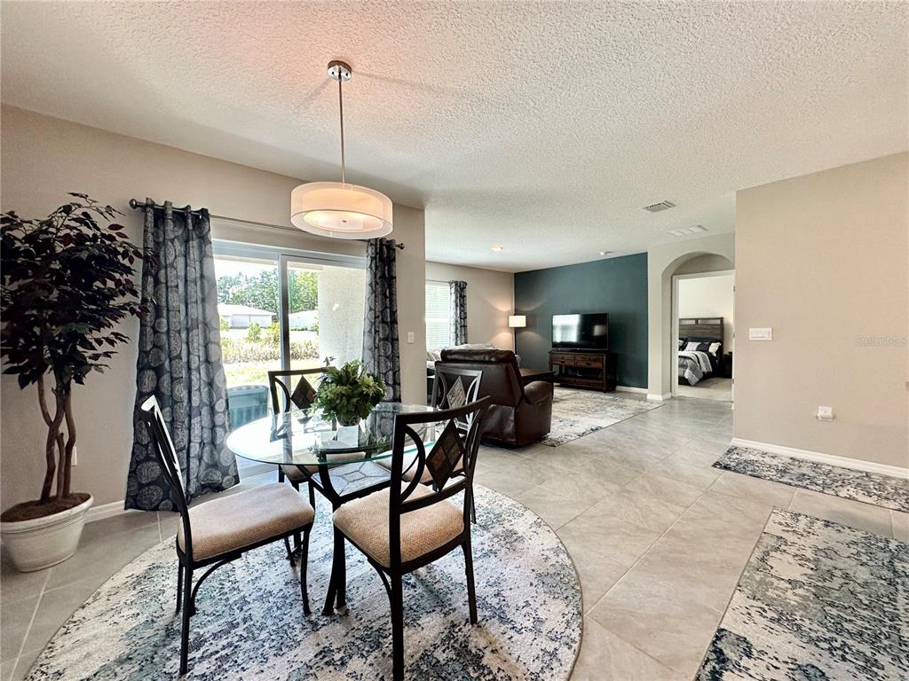 19 Hickory Course Radiel Ocala, FL 34472 - Photo 6 of 22 a living room with furniture and a chandelier