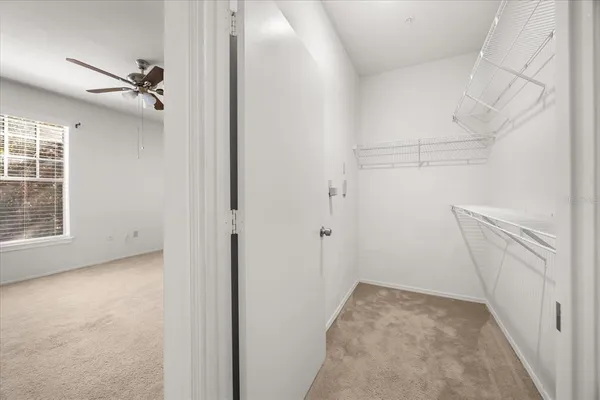 a spacious bathroom with a granite countertop sink a toilet and a shower