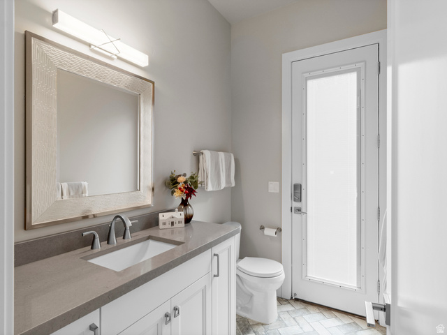 614 East High Lane Alpine, UT 84004 - Photo 48 of 75 Half bath featuring vanity and toilet