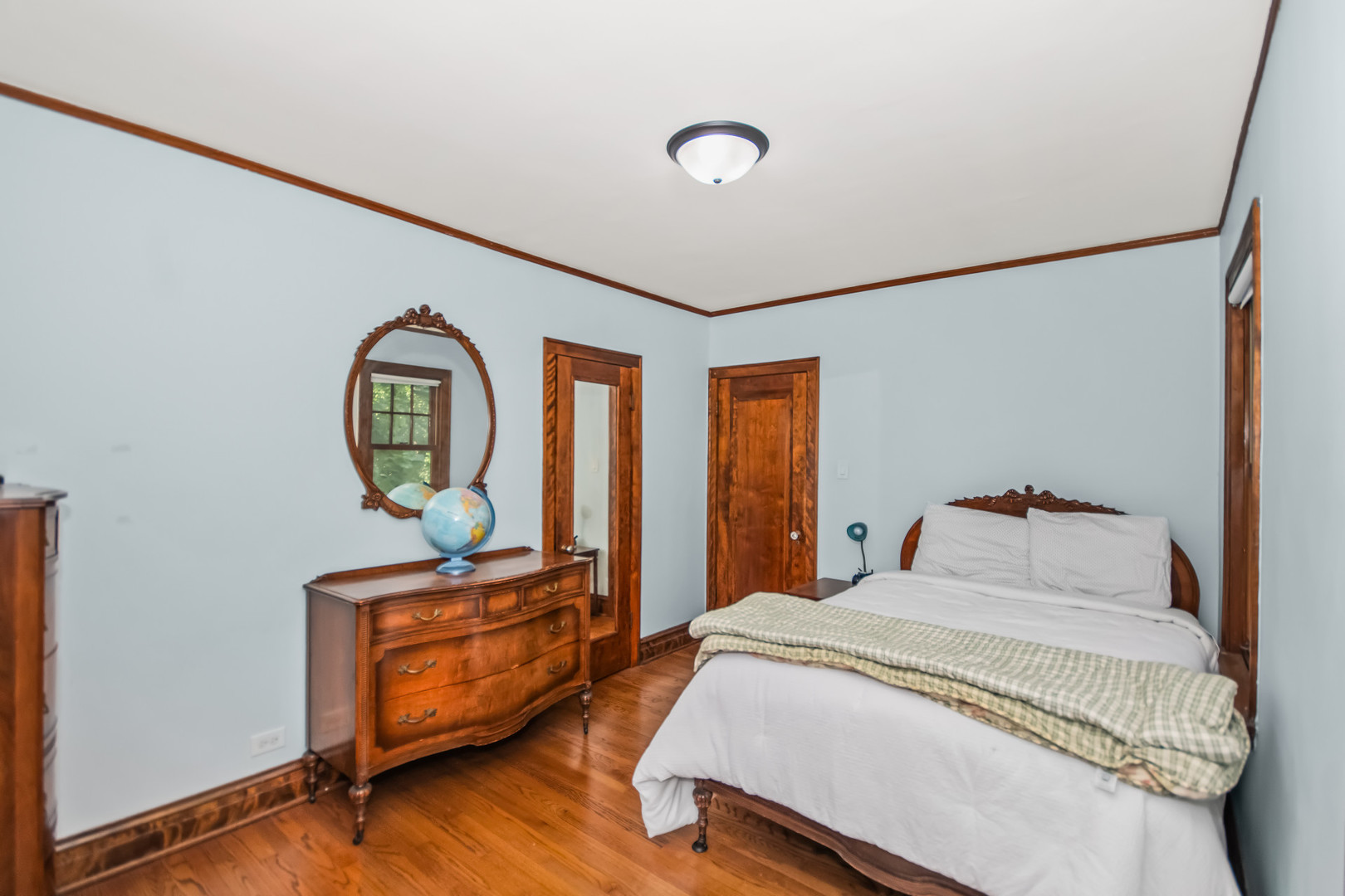 525 Wisner Street Park Ridge, IL 60068 - Photo 23 of 37 a bedroom with a bed and wooden floor